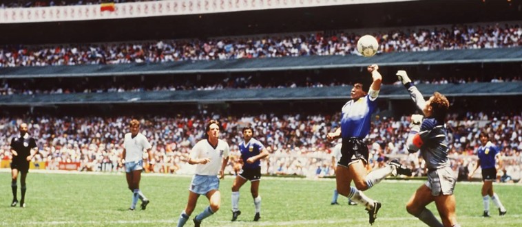 Let's start under the warm summer sun of 1986: which legendary player gently nudged the ball into the net with his hand, calling it the 'Hand of God'?