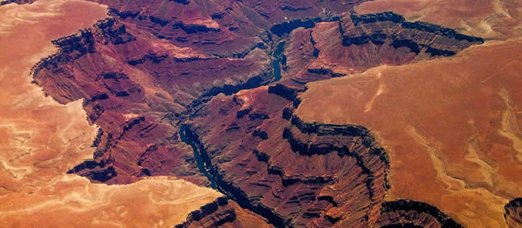 If you wanted to watch the sun sinking low over this legendary, deep-cut canyon, which state would you be visiting?