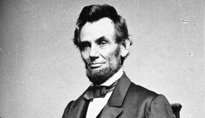 The nation's heart fractured into the Civil War during this man's presidency, and a tragic evening cut his second term short. Which president held the reins of the country through those heavy years of 1861 to 1865?
